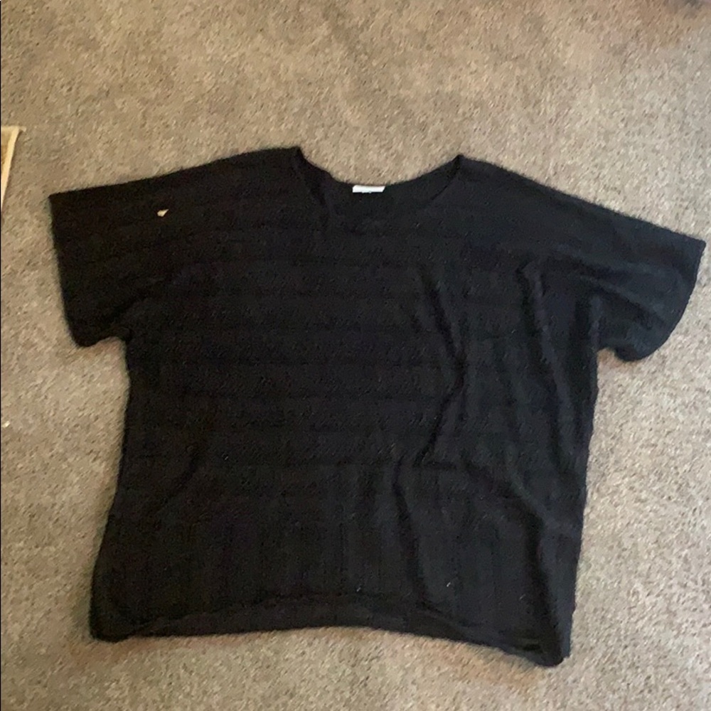 We have a back blouse with tiny sparkles in it